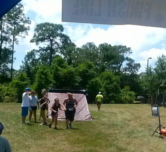 Running into the finish, cheered on by the best of friends!